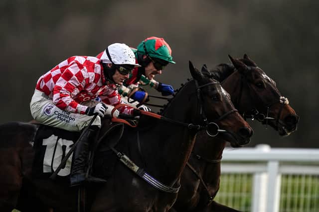 Saint Palais ridden by Harry Bannister (left) win the Mandarin Chase at Newbury.