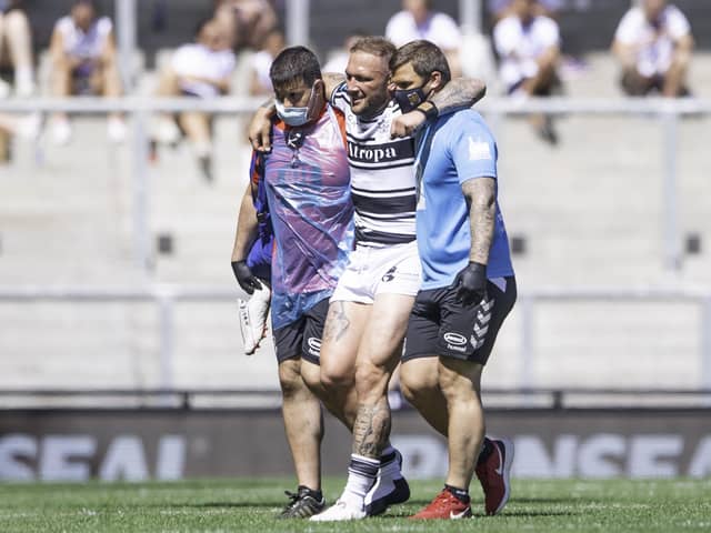 Hull FC's Josh Griffin is helped from the field after injury against St Helens. Picture by Allan McKenzie/SWpix.com