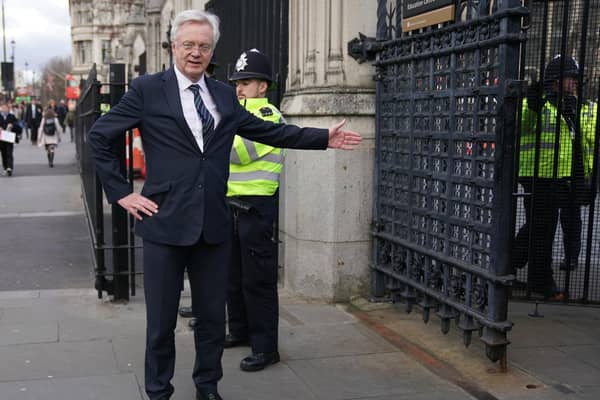 MP David Davis gestures to an aide as he leaves the Houses of Parliament in Westminster, London this week