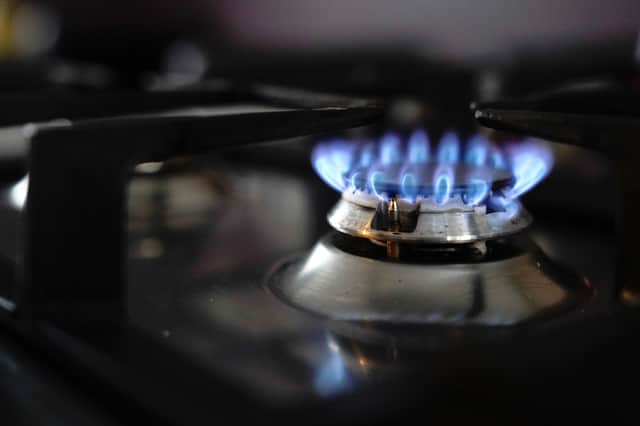 General view of a gas hob burning on a stove in a kitchen in Basingstoke, Hampshire. (PA)