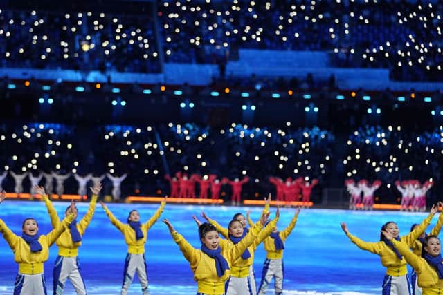 Dancers perform during the pre-show ahead of the opening ceremony of the 2022 Winter Olympics, Friday, Feb. 4, 2022, in Beijing. (AP Photo/Jae C. Hong)