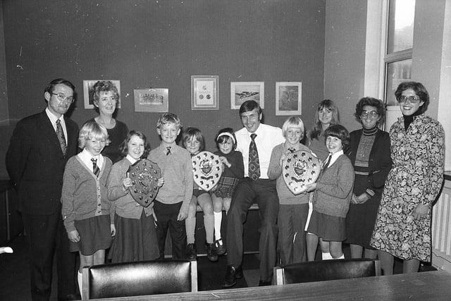 Prizewinning young journalists and their teachers saw the newspaper being printed before their prizes in the Silver Jubilee newspaper contest were handed over by "Post" editor Mr Barry Askew. Pictured: Barry Askew, with Mr D Shone and Mrs D Sully, with children from St John's Primary, Lytham - Catherine Willasey, Kelsey Wood and Christopher Darley; Mrs Marjorie Rollston (head) and Mrs Susan Duke with Scott Newton and Catherine Rigby from Devonshire infants; and Mrs J Nettleship with Joan Hindle of Longton junior school