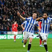 Duane Holmes celebrates scoring the only goal of the game for Huddersfield with team-mate Carel Eiting. Picture: Simon Hulme.