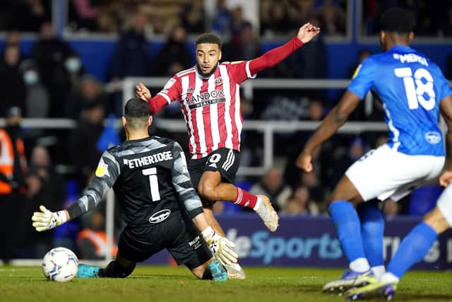 COMPOSURE: Sheffield United's Jayden Bogle scores his side's second goal of the game past Birmingham City goalkeeper Neil Etheridge. Picture: Mike Egerton/PA Wire.