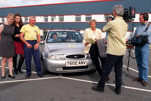 Staff at Richmond Foods were re-taking their driving test as part of a new BBC TV programme called 'The Crime Squad'. Pictured, from left, are Dawn Clemtents, Ruth Patrick, David Firth, Rob Addison in the car with AA Instructor Bob Mc Ainsh, Sue Lawley the programme's presenter and camera crew Mike Jackson and Adrian Tomlin.