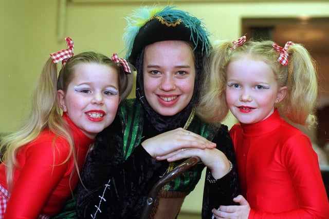 February 1997 and final rehearsals were underway for the Crossgates Village Welfare Association's pantomime 'Puss In Boots' being staged at Penda's Way Community Centre. Pictured is principal character Claire Brown with two of the young dancers Terri Marie Calvert (left) and Caroline Hardy.