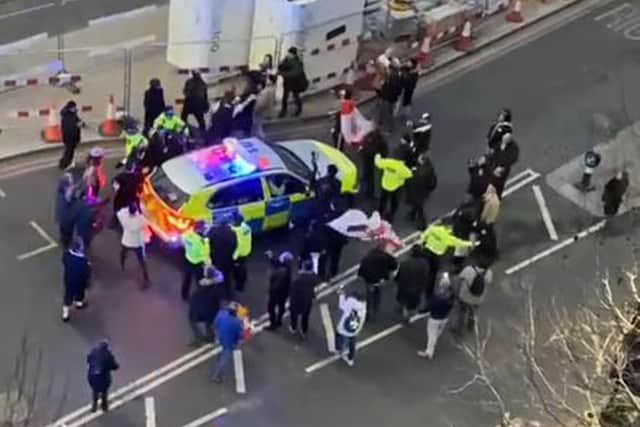 Clashes between police and protesters in Westminster as officers use a police vehicle to escort Labour leader Sir Keir Starmer to safety