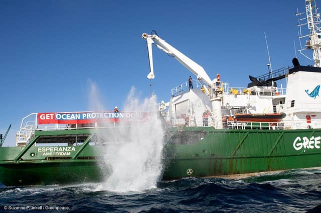 A boulder falling into the English Channel from the MV Esperanza in February 2021 Credit: Suzanne Plunkett/Greenpeace