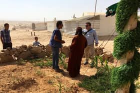 Professor Anthony Ryan, from the University of Sheffield, talking to people at  Zaatari refugee camp in Jordan. It is currently home to around 80,000 people.