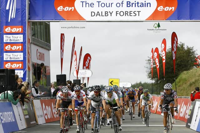 Tour of Britain riders cross the finish line in Dalby Forest, North Yorkshire, in 2008