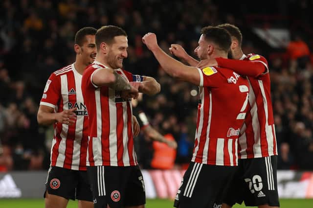 Sheffield United captain Billy Sharp celebrates his opener against West Brom with his team-mates. Picture: SPORTIMAGE.