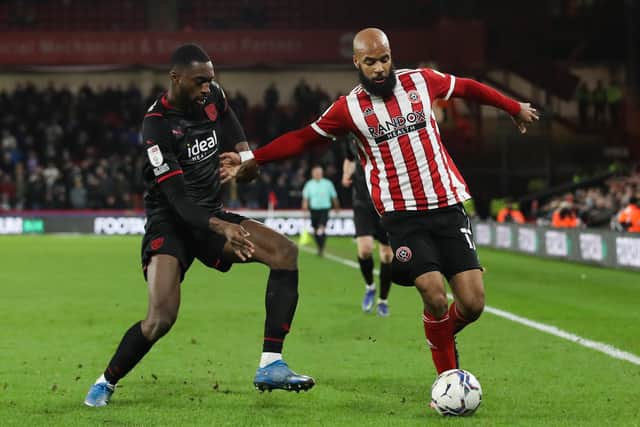 David McGoldrick of Sheffield Utd (right) and Semi Ajayi of West Bromwich Albion battle for the ball (Picture: Isaac Parkin / Sportimage)