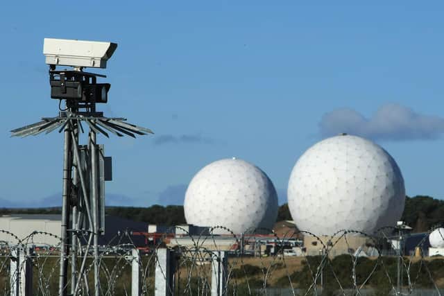 Razor wire and CCTV protect the golf ball spy cameras intercepting intelligence from around the world.