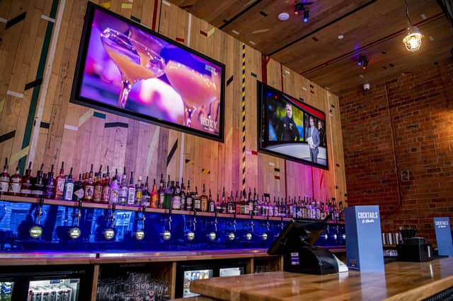 Customers can choose from a selection of craft beers, cocktails and spirits, as well as pizza slices and fries.