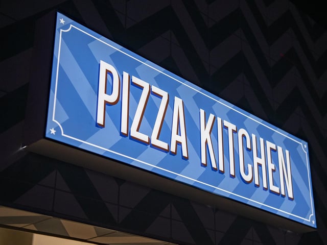 Pizza slices and fries are on the menu in the new kitchen at Roxy Lanes.