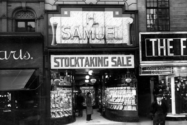 H. Samuel, jewellers on Briggate in February 1938. On the left, just visible, is Ciro Pearls Lts with entrance to Dodsworth Court and 'Fifty shilling tailors' on the right.