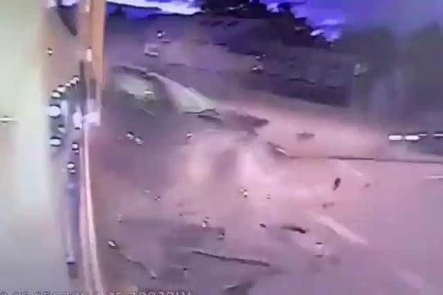 Heart-stopping footage shows the Toyota Corolla smashing into the side of a HGV at a roundabout