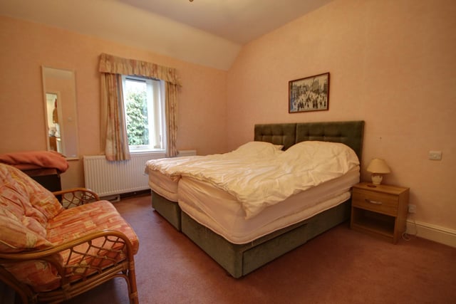 One of the double bedrooms within the home. Two bedrooms have en suite shower rooms.