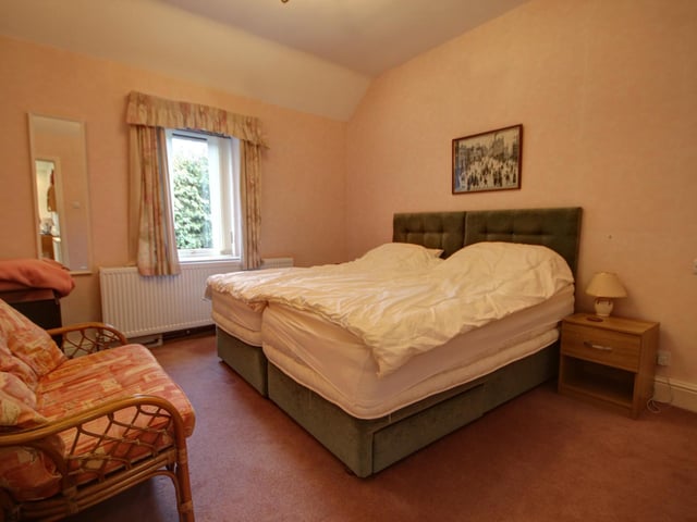 One of the double bedrooms within the home. Two bedrooms have en suite shower rooms.