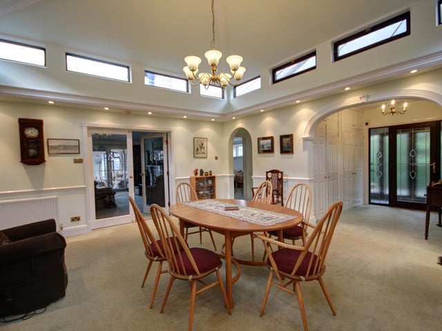 This central reception area has doors to most other rooms within the property.
