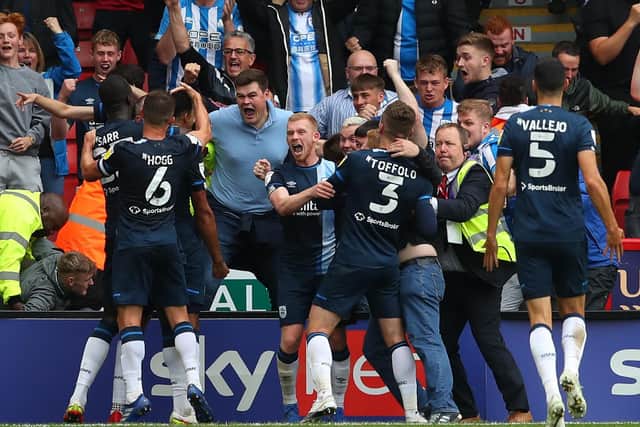 Levi Colwill of Huddersfield Town is mobbed after scoring the winning goal  against Sheffield United at Bramall Lane in August. Picture: Simon Bellis / Sportimage