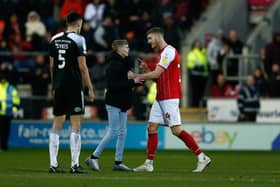 Rotherham United's Michael Smith interacts with a pitch invader during the Sky Bet League One match at AESSEAL New York Stadium, Rotherham. (Picture: Will Matthews/PA)