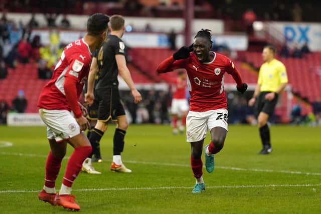 Barnsley's Domingos Quina celebrates scoring the openin goal during the Sky Bet Championship match at Oakwell (Picture: PA)