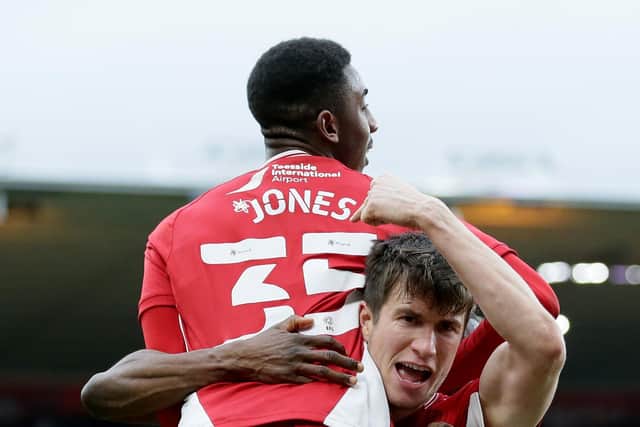 Middlesbrough's Isaiah Jones is congratulated by team-mate Paddy McNair after his cross found team-mate Matt Crooks (not pictured) to score their second goal against Derby (Picture: PA)