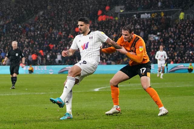 Fulham's Aleksandar Mitrovic (left) and Hull City's Sean McLoughlin (Picture: PA)