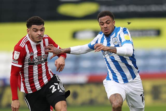 Sheffield United's Morgan Gibbs-White (left) and Huddersfield Town's Josh Koroma in action (Picture: PA)