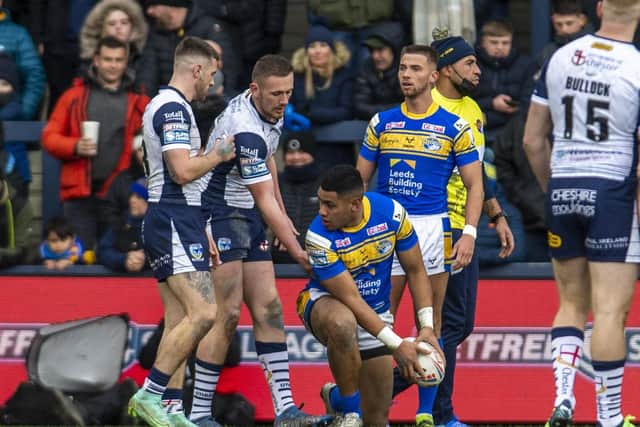 Leeds Rhinos' David Fusitu'a helped to his feet after a late tackle. (Picture: Tony Johnson)
