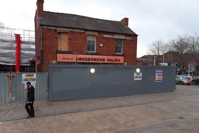 The Henderson's building on Leavygreave Road, Sheffield, with the hoardings which carry demolition site warnings