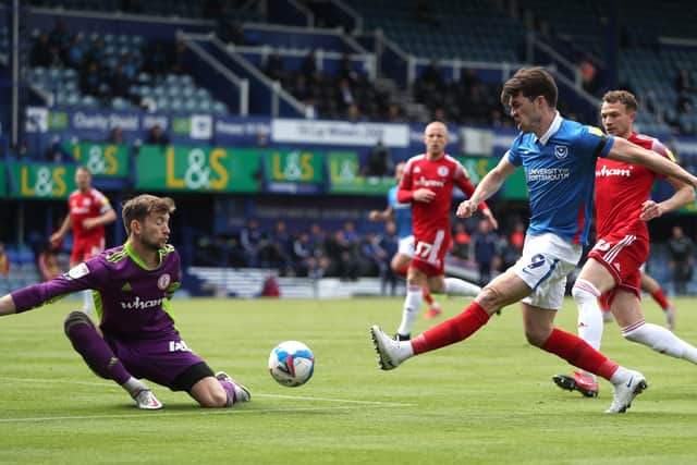 Portsmouth's John Marquis sees his shot saved during the Sky Bet League One match at Fratton Park, Portsmouth. Picture date: Sunday May 9, 2021. PA Photo. See PA story SOCCER Portsmouth. Photo credit should read: Kieran Cleeves/PA Wire.

RESTRICTIONS: EDITORIAL USE ONLY No use with unauthorised audio, video, data, fixture lists, club/league logos or "live" services. Online in-match use limited to 120 images, no video emulation. No use in betting, games or single club/league/player publications.
