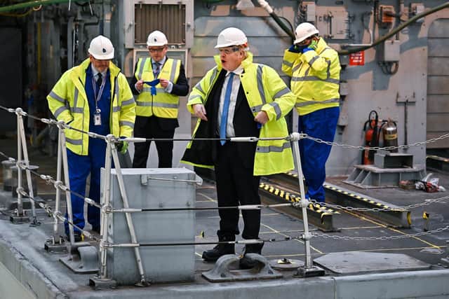 Prime Minister Boris Johnson is shown a vessel undergoing refit for the Ukrainian Navy during a visit to Rosyth Dockyard near Edinburgh (PA)