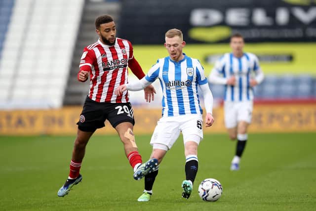 Sheffield United's Jayden Boglel (left) and Huddersfield Town's Lewis O'Brien battle for the ball during Saturdya's goalless draw (Picture: PA)