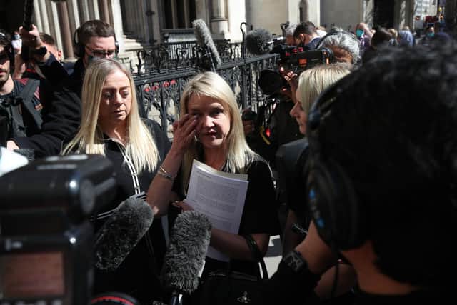 Former post office worker Janet Skinner (centre) had her conviction overturned last year - but hundreds of other victims are yet to come forward, MPs have warned.