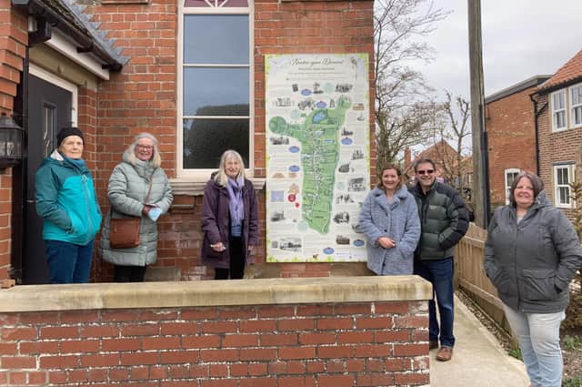 Newton upon Derwent Local History Group members with one of the new information boards.