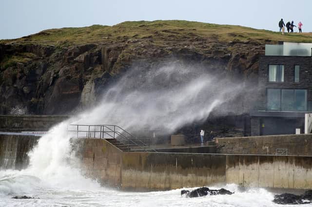 Big waves hit the sea wall at Portstewart in County Londonderry, Northern Ireland, as Storm Dudley hits. Weather forecasters expect Storm Eunice to be more ferocious than Storm Dudley, and have issued a rare Red Alert. PA.