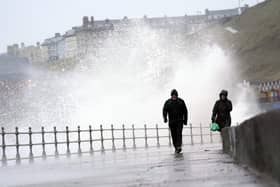 Big waves hit the sea wall at Whitby, Yorkshire, earlier this week when Storm Dudley hit the north of England. Storm Eunice is expected to be more intense with London and the South West worst hit. PA.