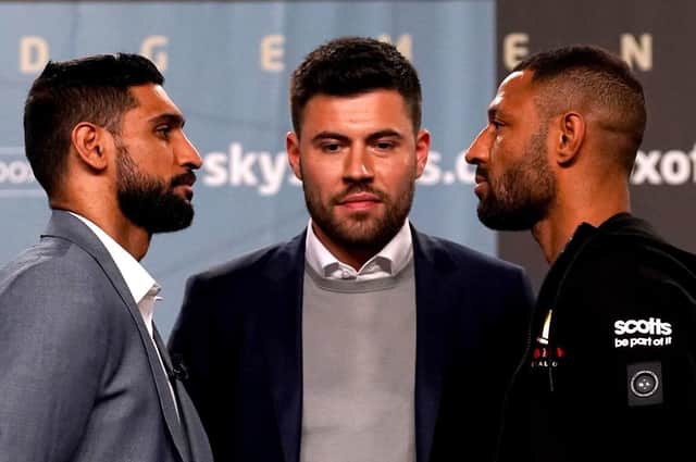Face to face: Long-time feuding fighters Amir Khan (left) and Kell Brook with, promoter Ben Shalom at the Exchange Hall, Manchester. Picture: Nick Potts/PA Wire.
