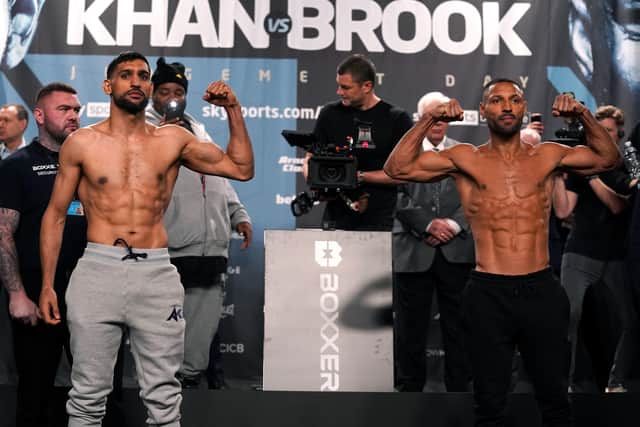 Amir Khan (left) and Kell Brook during the weigh-in at the Exchange Hall, Manchester. Picture: Nick Potts/PA Wire.