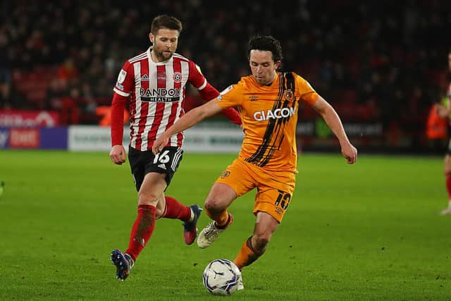 Sheffield United's Oliver Norwood battles with Hull City's George Honeyman at Bramall Lane on Tuesday night. Picture: Simon Bellis/Sportimage