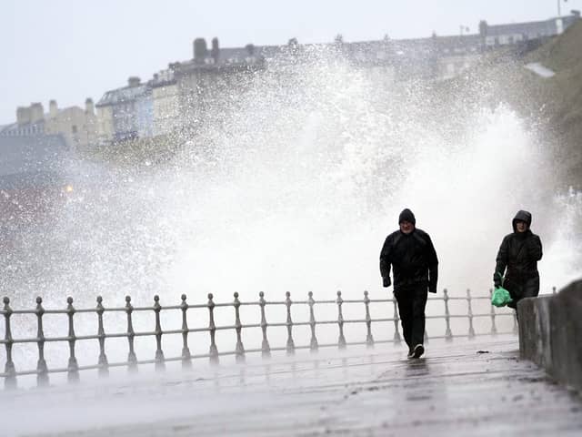 Big waves hit the sea wall at Whitby Yorkshire, before Storm Dudley hits the north of England