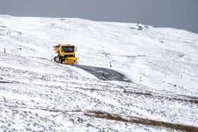 A snow plough on the Buttertubs Pass near Hawes, North Yorkshire, on Saturday February 19
