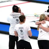Great Britain coach David Murdoch, Eve Muirhead, Vicky Wright, Jennifer Dodds, Hailey Duff, Mili Smith and coach Kristian Lindstrom celebrate winning gold Picture: Andrew Milligan/PA