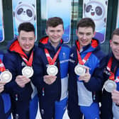 Great Britain's Bobby Lammie, Hammy McMillan, Bruce Mouat, Grant Hardie and Ross Whyte celebrate with their silver medals in Beijing. Picture: Andrew Milligan/PA