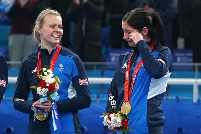 Great Britain's Vicky Wright and Eve Muirhead celebrate with the gold medal at the National Aquatics Centre in Beijing. Picture: Andrew Milligan/PA