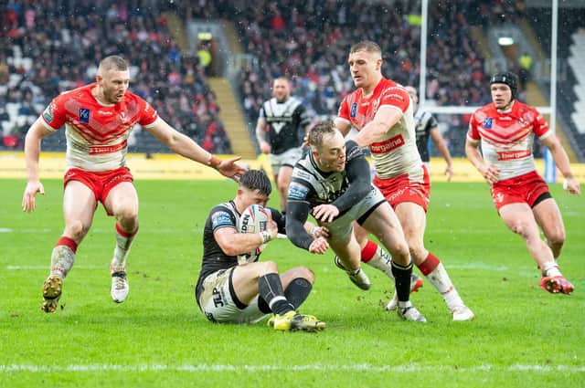 TOUGH DAY: Hull FC's Jamie Shaul gathers the ball as Adam Swift falls with St Helens's Joe Batchelor & Matty Lees closing in. Picture by Allan McKenzie/SWpix.com