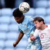 Coventry City's Ian Maatsen and Barnsley's Callum Brittain compete for the ball in the air. Picture: PA