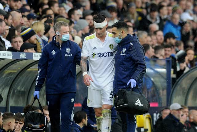 Leeds United's Robin Koch is helped off the pitch at Elland Road after suffering a head injury. Picture: Simon Hulme.